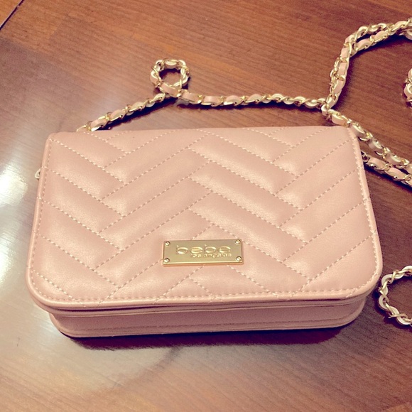 bebe Handbags - BEBE LIGHT PINK CROSSBODY. Pink rope like material throughout strap.Quilted.NWOT